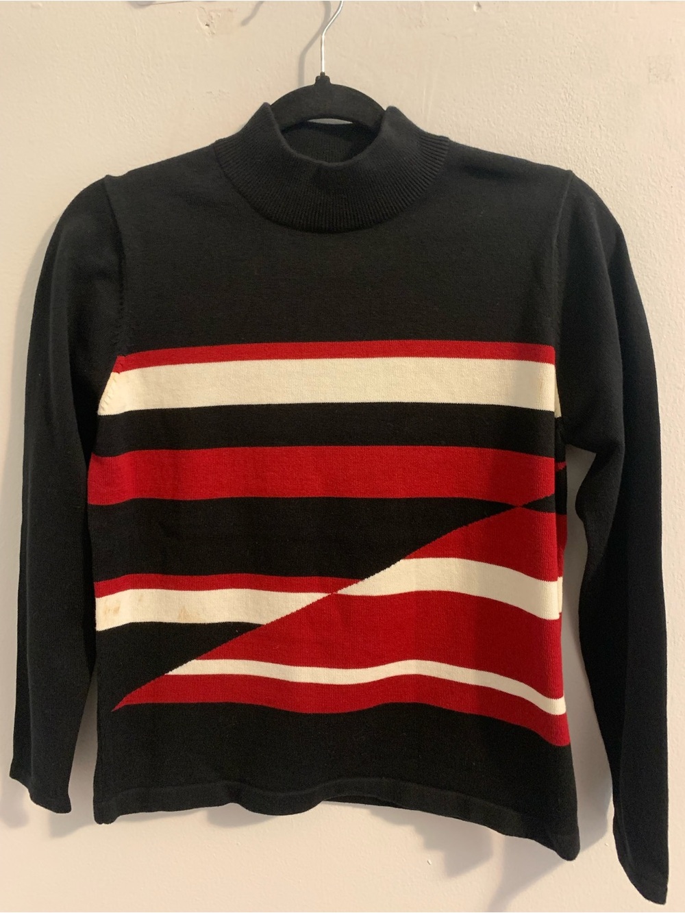 Black Turtleneck Sweater with Red and White Graphic Stripes